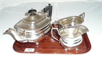 Lot 263 - A George V silver three piece tea service, Birmingham 1935, approx. 28oz, retailed by Harrods