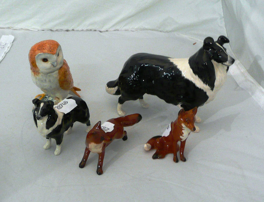 Lot 265 - Beswick owl, two Beswick collie dogs and two Beswick foxes (5)