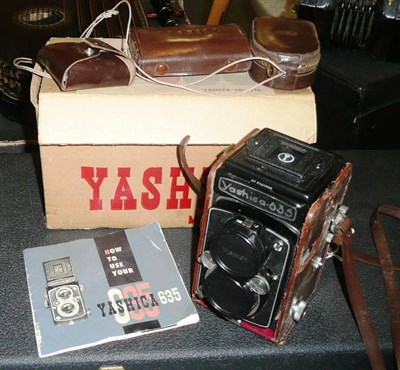 Lot 323 - A Yashica 635 Twin Lens Reflex Camera No.SX5020332, in stitched leather case, with converter,...