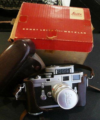 Lot 324 - A Leica M3 Camera No.856878, circa 1957, in chrome, with removable light meter and Summicron...