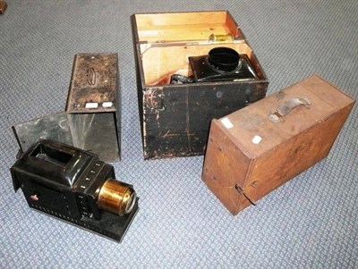 Lot 342 - Three Magic Lanterns:- black enamelled tinplate lantern with brass lens and two mahogany framed...