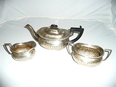 Lot 350 - A silver three piece tea set, London assay