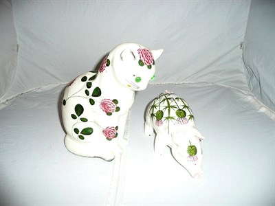 Lot 355 - Plichta pottery cat painted with pink flowers and pig decorated with thistles (2)