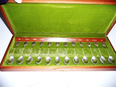 Lot 360 - A set of twelve silver gilt Royal Horticultural Society flower teaspoons