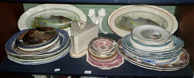 Lot 372 - A shelf of assorted pottery including meat dishes, plates, cheese dish and cover and vase etc