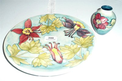 Lot 398 - Walter Moorcroft Fuchsia plate and a small 'Clematis' pattern vase (2)