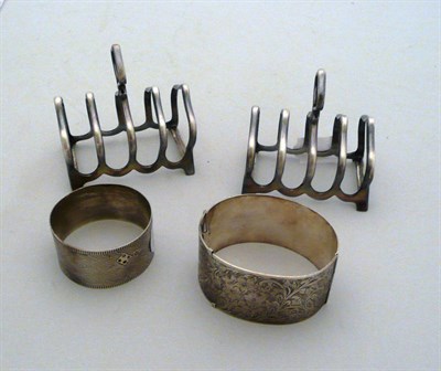 Lot 403 - Pair of plated toast racks, silver bangle and silver napkin ring