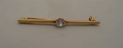 Lot 411 - A diamond-set bar brooch