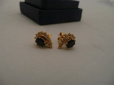 Lot 418 - Pair of gold, sapphire and diamond earrings