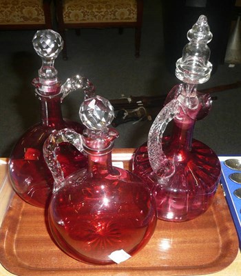 Lot 456 - Three cranberry glass bottles