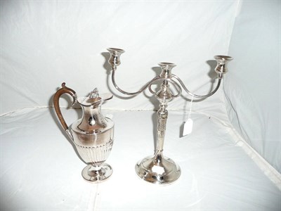 Lot 483 - Silver plated two branch candle holder and a plated claret jug