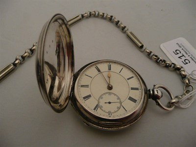 Lot 515 - A silver pocket watch and silver plated watch chain