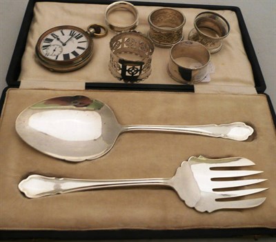 Lot 520 - Three silver napkin rings, two plated, Goliath pocket watch, and plated servers