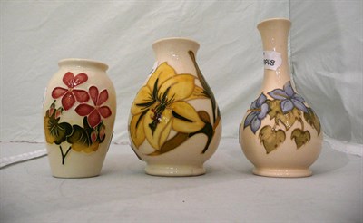 Lot 544 - Three Walter Moorcroft vases on white ground