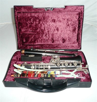 Lot 551 - An oboe by Buffet, Paris in hard plastic case and a music stand