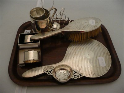 Lot 553 - Silver christening mug, toast rack, egg cup, tea strainer, small trophy cup, two napkin rings, pair