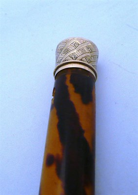 Lot 561 - Gold and tortoiseshell stick