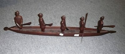 Lot 570 - Wooden boat with men