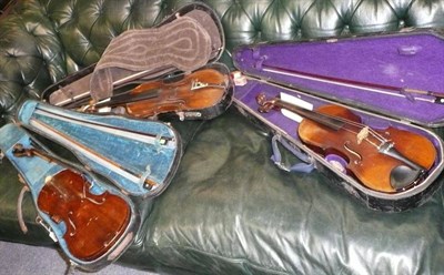 Lot 602 - Three cased violins - an early 19th century English with bow, a 19th century German with bow...