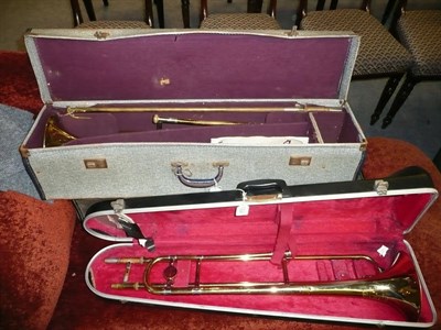 Lot 603 - Three brass Boosey & Hawkes 'Regent'  trombones, all in cases.