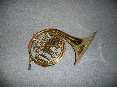 Lot 604 - A Paxman 'Primo' French horn, in a fitted case.