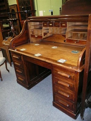 Lot 672 - Edwardian mahogany roll top desk