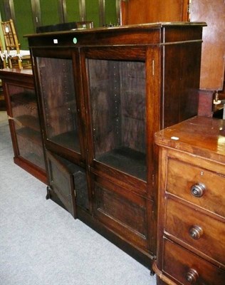 Lot 676 - An oak glazed cabinet