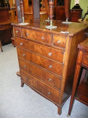 Lot 685 - A yew wood veneered chest of drawers