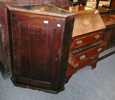 Lot 690 - An Edwardian mahogany and satinwood banded bureau and an oak corner cabinet