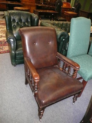 Lot 700 - Victorian easy chair upholstered in brown leather