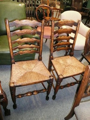 Lot 720 - Pair of rush seated ladder back chairs