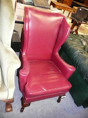 Lot 726 - Wing back armchair in burgundy leather