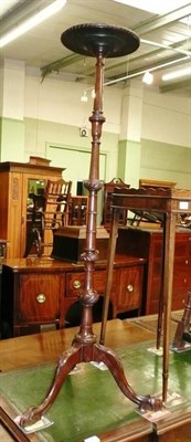 Lot 740 - Mahogany torchere with moulded rim and turned bulbous support