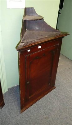 Lot 770 - George III mahogany hanging corner cupboard