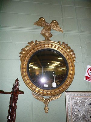 Lot 789 - Regency gilt and gesso wall mirror surmounted by an eagle