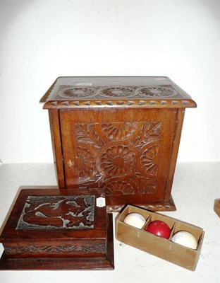 Lot 13 - A carved oak smoker's cabinet, a carved oak box and a boxed set of crystalate balls
