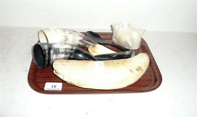 Lot 19 - A carved whale tooth, five pieces of horn and a carved stone ornament