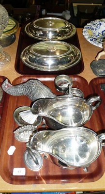 Lot 47 - Two trays including a pair of silver plated entree dishes, a pair of sauce-boats, plated glass...