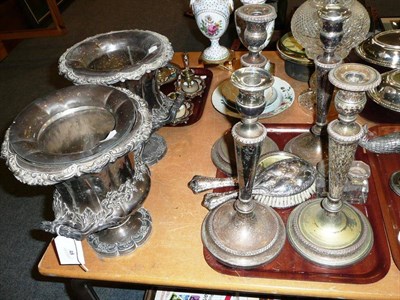 Lot 48 - Pair of silver-plated campana-shaped wine coolers, four plated candlesticks, silver hand...