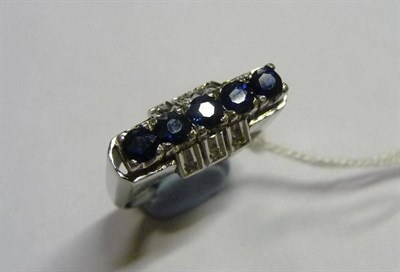 Lot 63 - A fancy sapphire and diamond ring