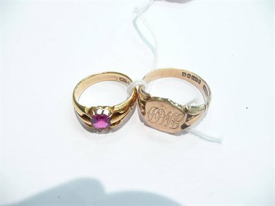 Lot 74 - An 18 carat gold garnet ring and a 9 carat gold engraved signet ring