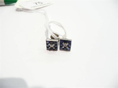 Lot 75 - A pair of diamond and sapphire earrings