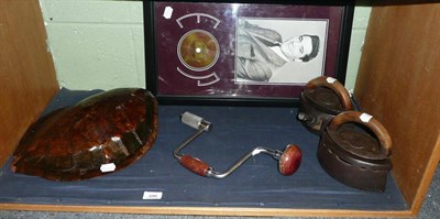 Lot 100 - Turtle shell, two flat irons, framed Elvis CD and a brace (5)