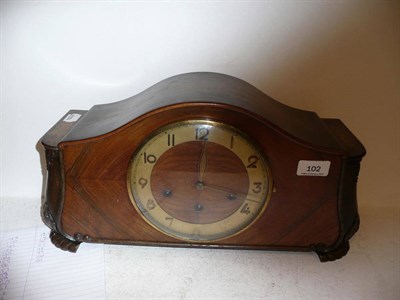 Lot 102 - A three train walnut mantel clock