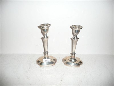 Lot 113 - Pair of silver candlesticks