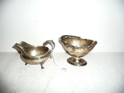 Lot 127 - A silver basket, London 1908, Horace Woodward and Co. Ltd. and a silver sauce boat, London...