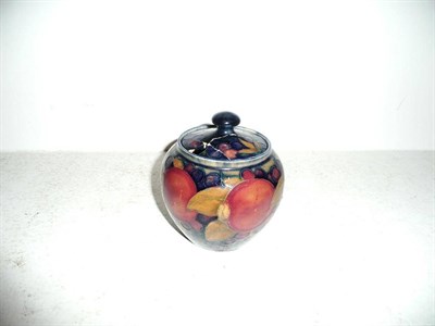 Lot 144 - William Moorcroft "Pomegranate" preserve jar and cover (a.f.)