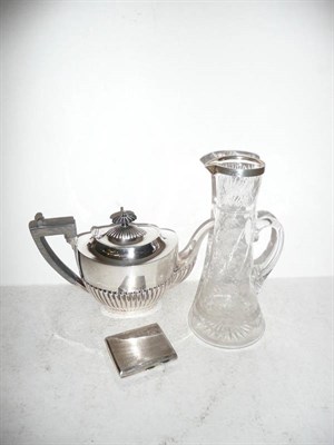 Lot 145 - A silver mounted claret jug, Chester 1905, silver cigarette case, Birmingham 1931 and a plated...