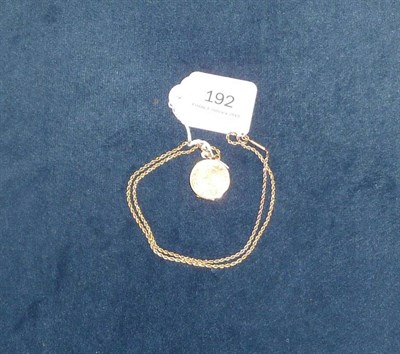 Lot 192 - A gold plated photograph locket and 9 carat gold chain, 13.3g