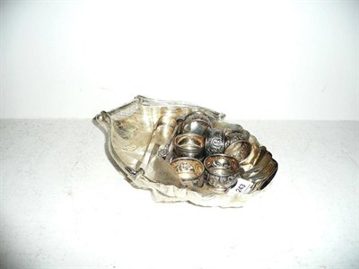 Lot 243 - Silver shell-shaped basket, Birmingham assay, two pairs sugar tongs and six silver napkin rings